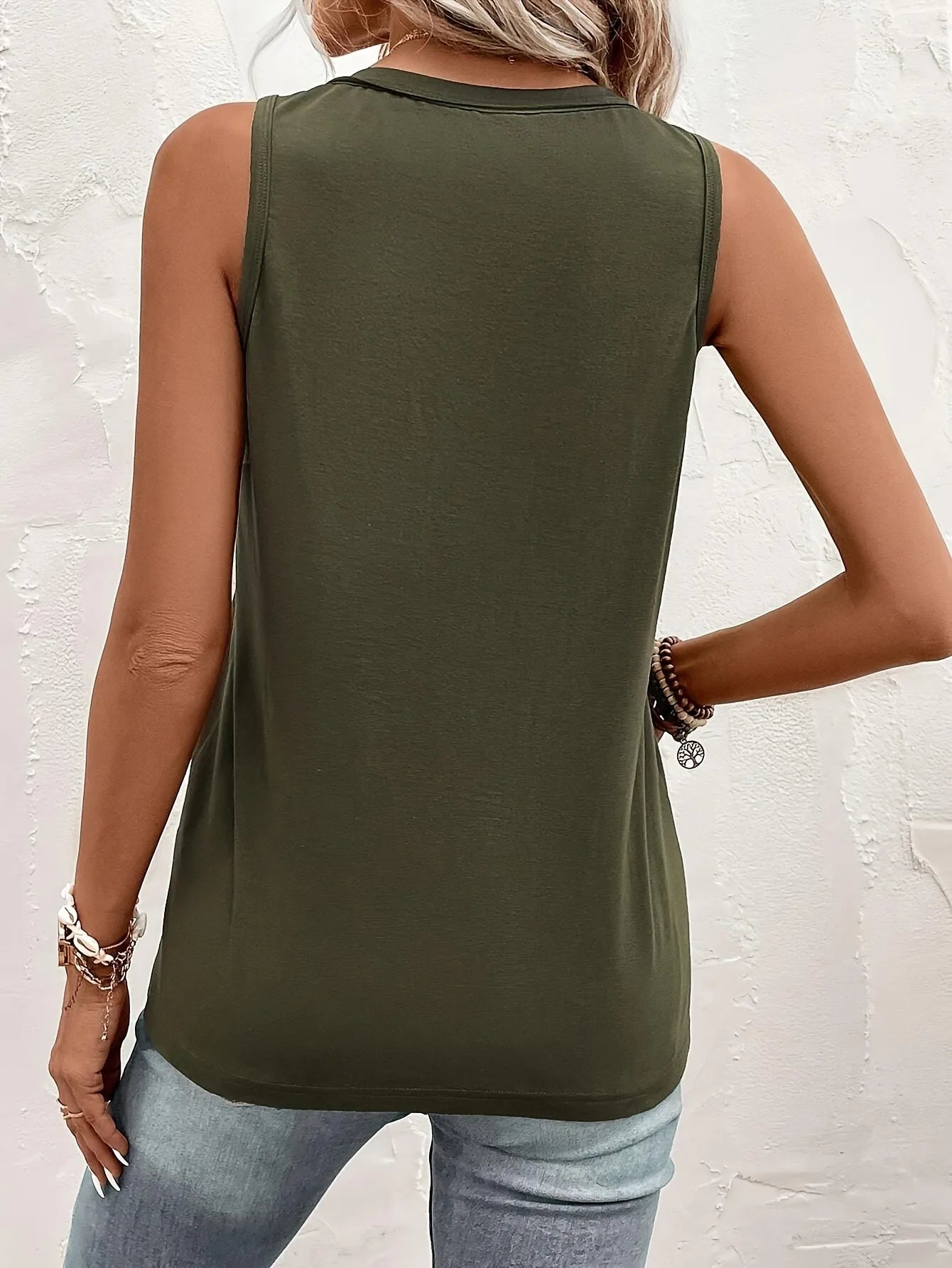 Lady's olive green vest with front pocket and sleeveless top. Perfect for casual streetwear, a versatile piece that can be worn